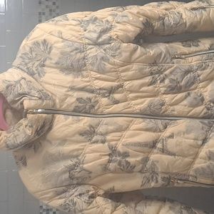 MDC winter jacket. Creme  and grayvcolored with a Parisienne background.